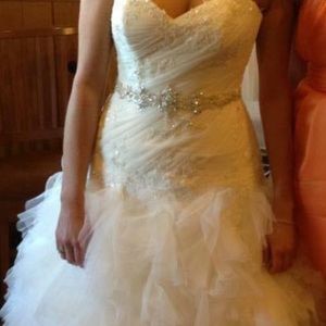 Maggie Sottero wedding gown. Size 14. Worn once and has been preserved.